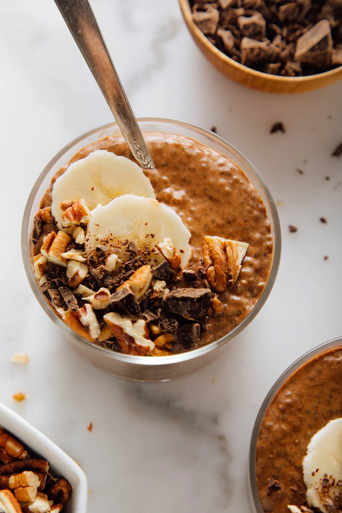 Bowl of rich chocolate chia pudding with toppings