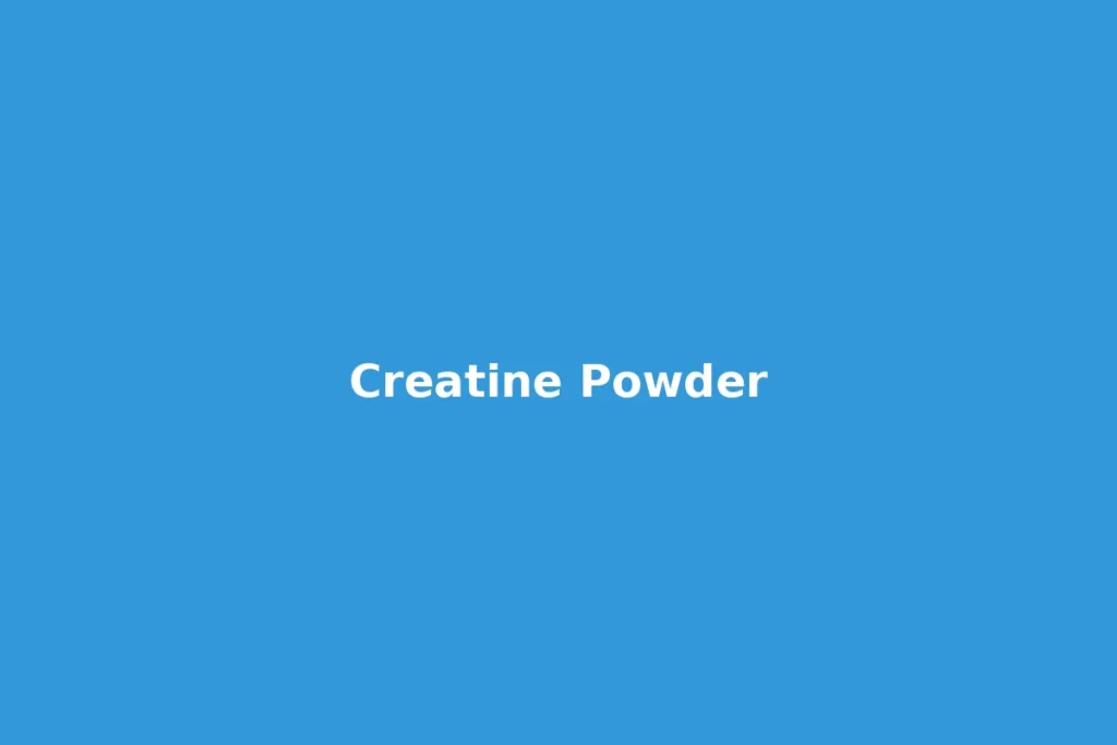Creatine powder scoop next to a shaker bottle