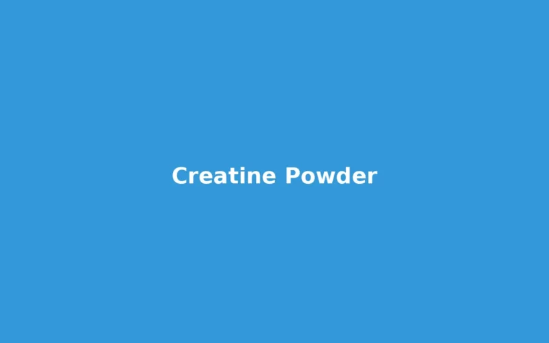 Creatine powder scoop next to a shaker bottle