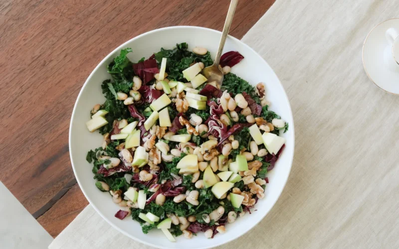Colorful salad bowl with fresh vegetables and grains