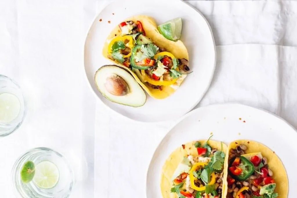 Colorful breakfast taco ingredients laid out on counter