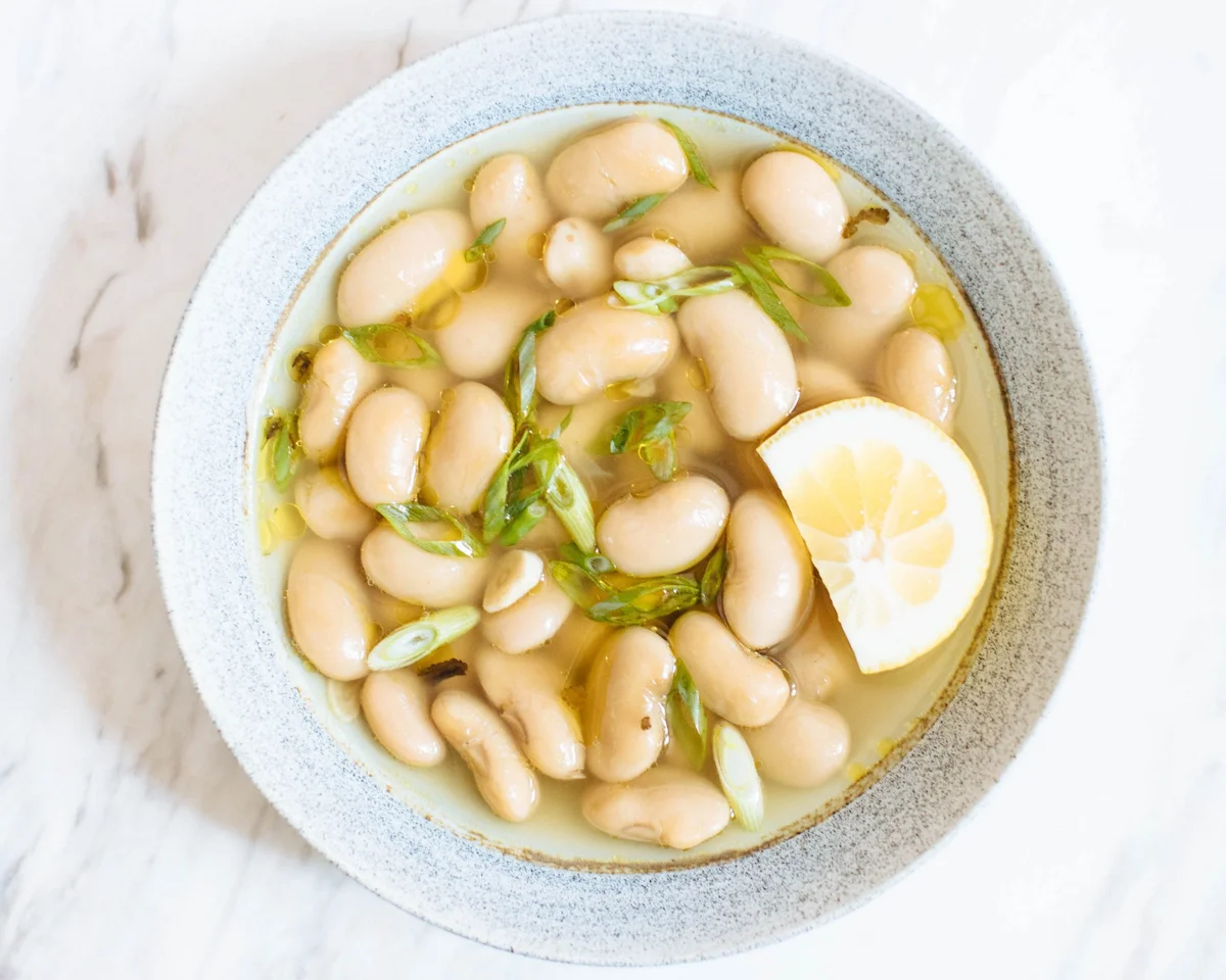 White bean soup in bowl with broth