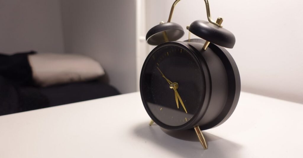 Alarm clock on a bedside table in a calm bedroom