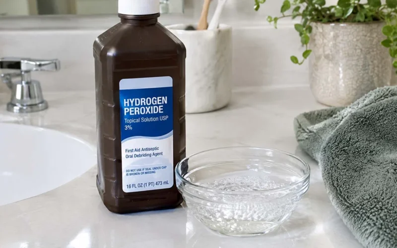 Brown hydrogen peroxide bottle on a bathroom counter